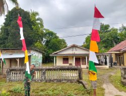 Satgas TMMD Kodim 0416/Bute dan Warga Tanjung Agung Gotong Royong Pasang Merah Putih Sambut Bulan Kemerdekaan