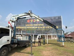 Jelang Penutupan TMMD Ke-129, Satgas Pasang Banner di Lapangan Tanjung Agung